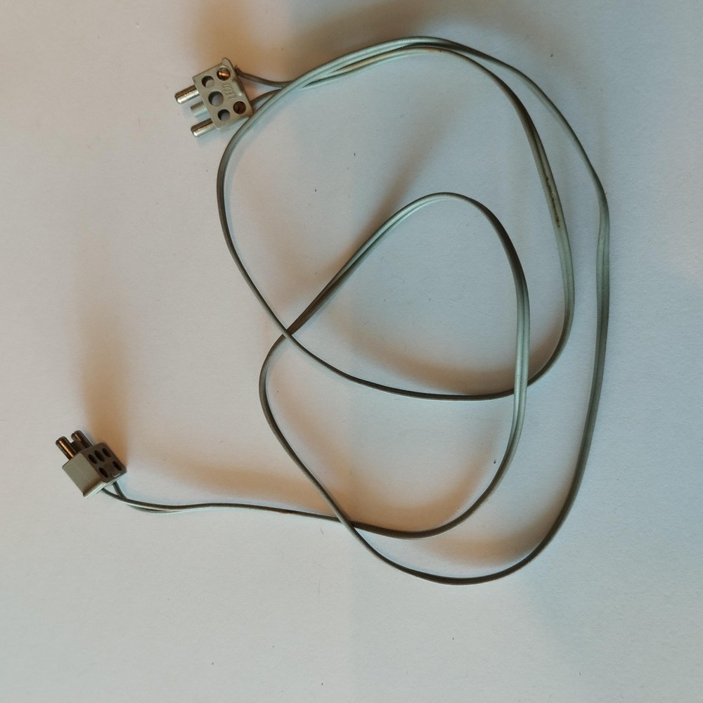 Vintage LEGO Technic parts including cables, engines, and train components