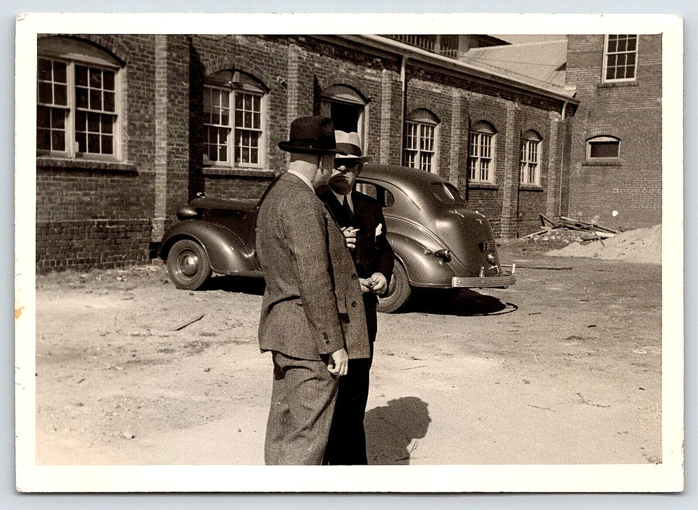 Vintage Antique Photo of Men in Suits Smoking by Old Building Outdoor Scene