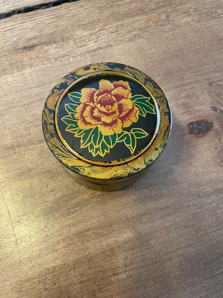 Vintage hand painted black lacquer trinket box with floral motif