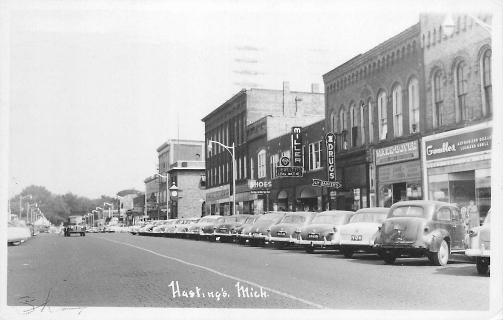 1955 Hastings Michigan Street Scene autos occupation RPPC Postcard 25-9173