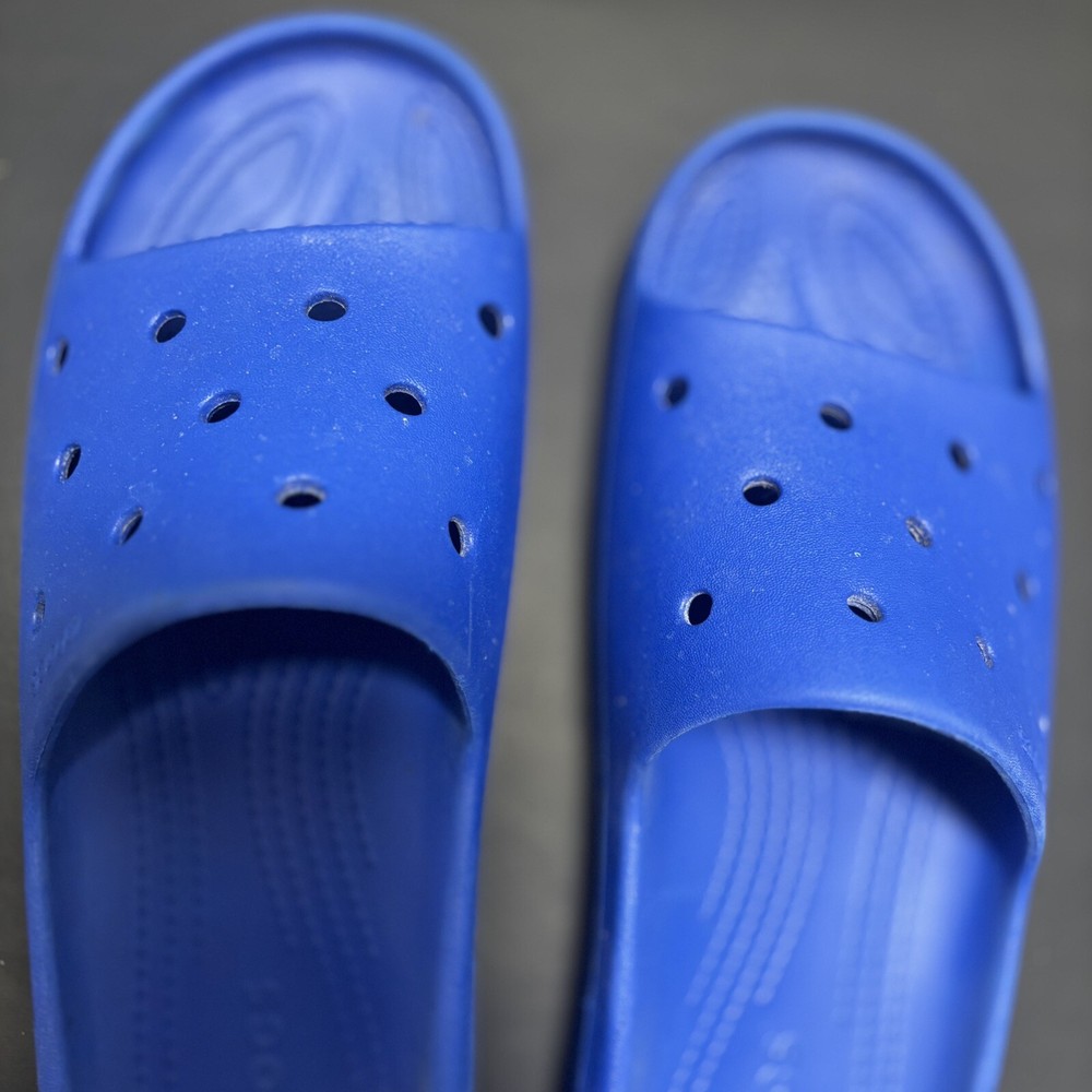 Men and Womens blue slides  by Crocs Mens Size 10 Women 12