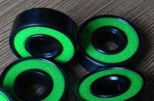 Set of 8 Skateboard Black Bearings w/Bronze Cage & Green Rubber Seals 8x22x7mm