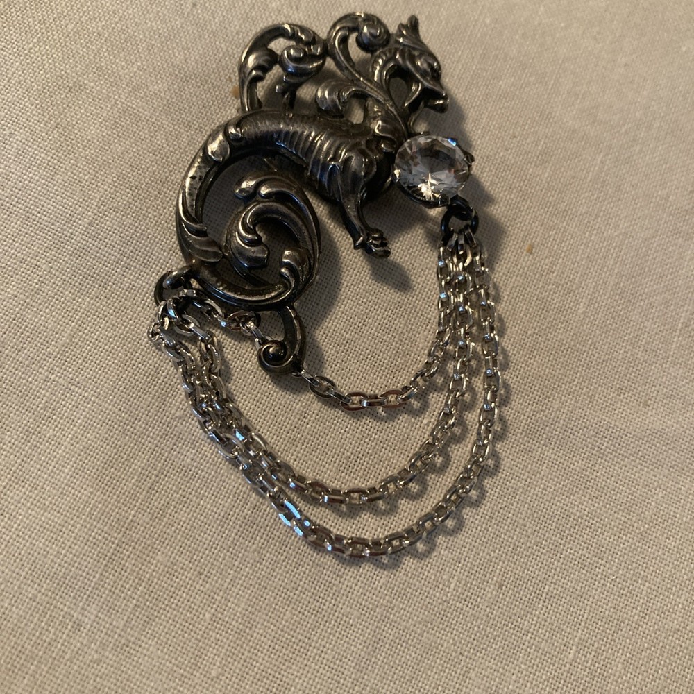 Sterling Silver CINI Dragon brooch with single large Rhinestone