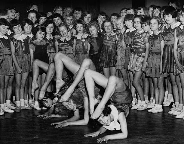 Young contortionists rehearse before an audience of budding pantom- Old Photo
