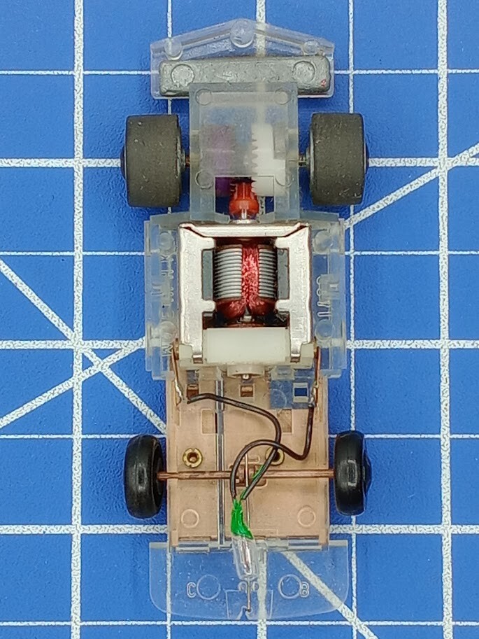 Vintage Slot Car Chassis with Lightbulb and Clear Frame