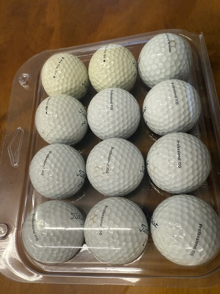 One dozen Titleist golf balls Professional 100 golf balls & Pro Trajectory