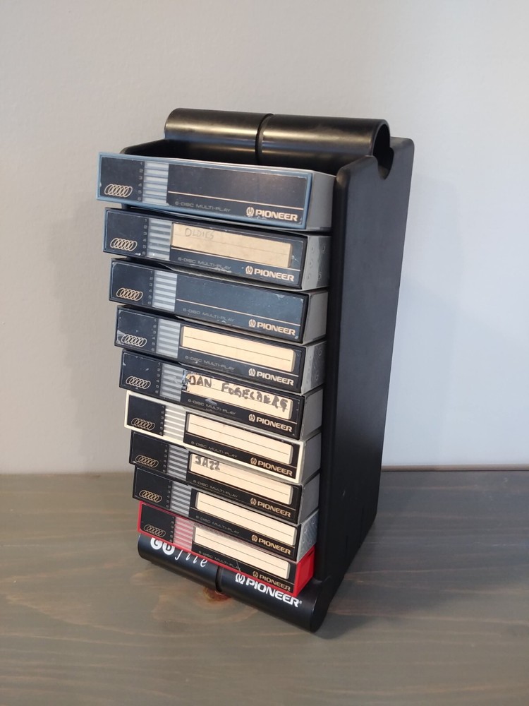 9 Pioneer 6 CD Magazines in a Pioneer Storage Tower. Very Good Condition.