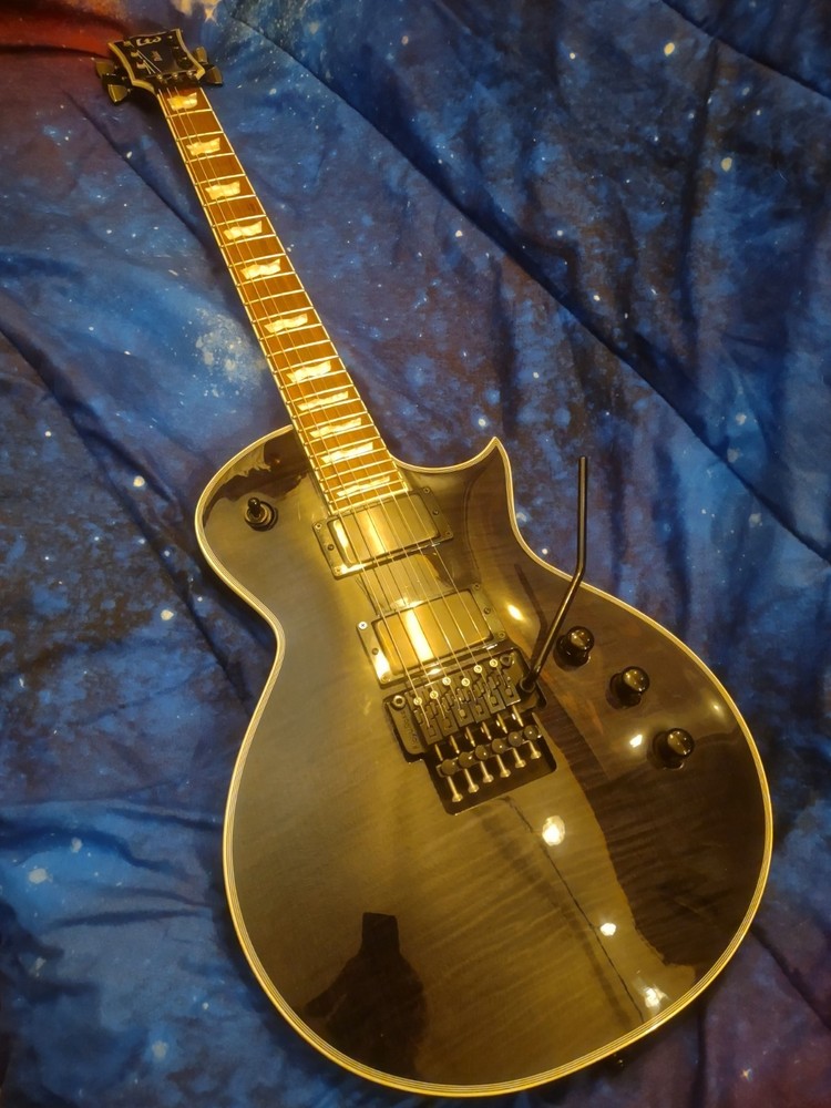 ESP LTD EC1000 FR Deluxe 6 String Electric Guitar EMGs Floyd Rose Trans Black