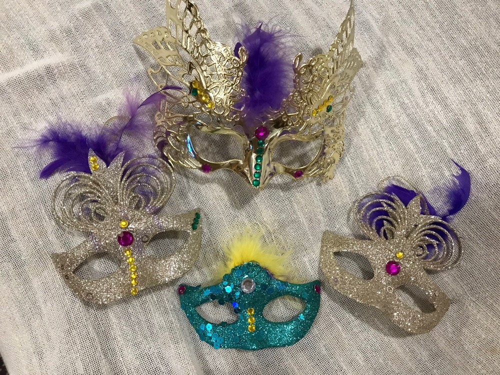 Mardi Gras decor mask and beads￼