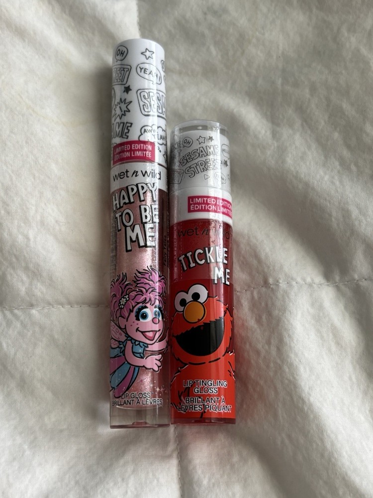 Wet n Wild Sesame Street Lip Gloss Set with Tickle Me Elmo and Happy To Be Me Abby