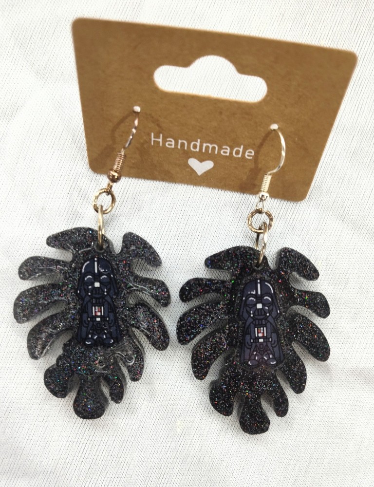 Handmade UV resin Darth Vader palm leaf dangle earrings with black glitter