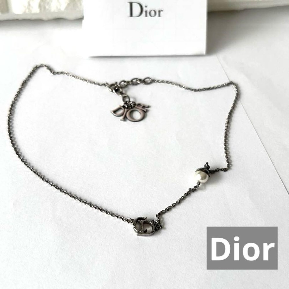 Dior pearl necklace with iconic CD logo charm