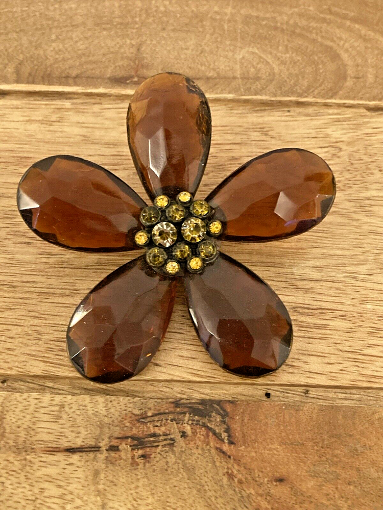 Large Translucent Brown Plastic flower brooch with a stone cluster centre