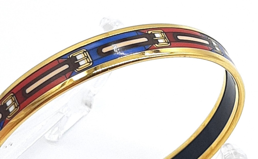 Hermes enamel bangle bracelet in gold with cloisonné belt pattern, red and blue, includes box