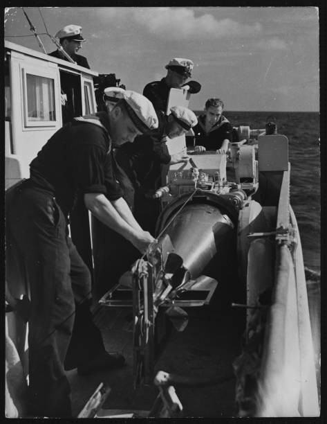 The crew of a German gunboat prepare a torpedo Historic Old Photo