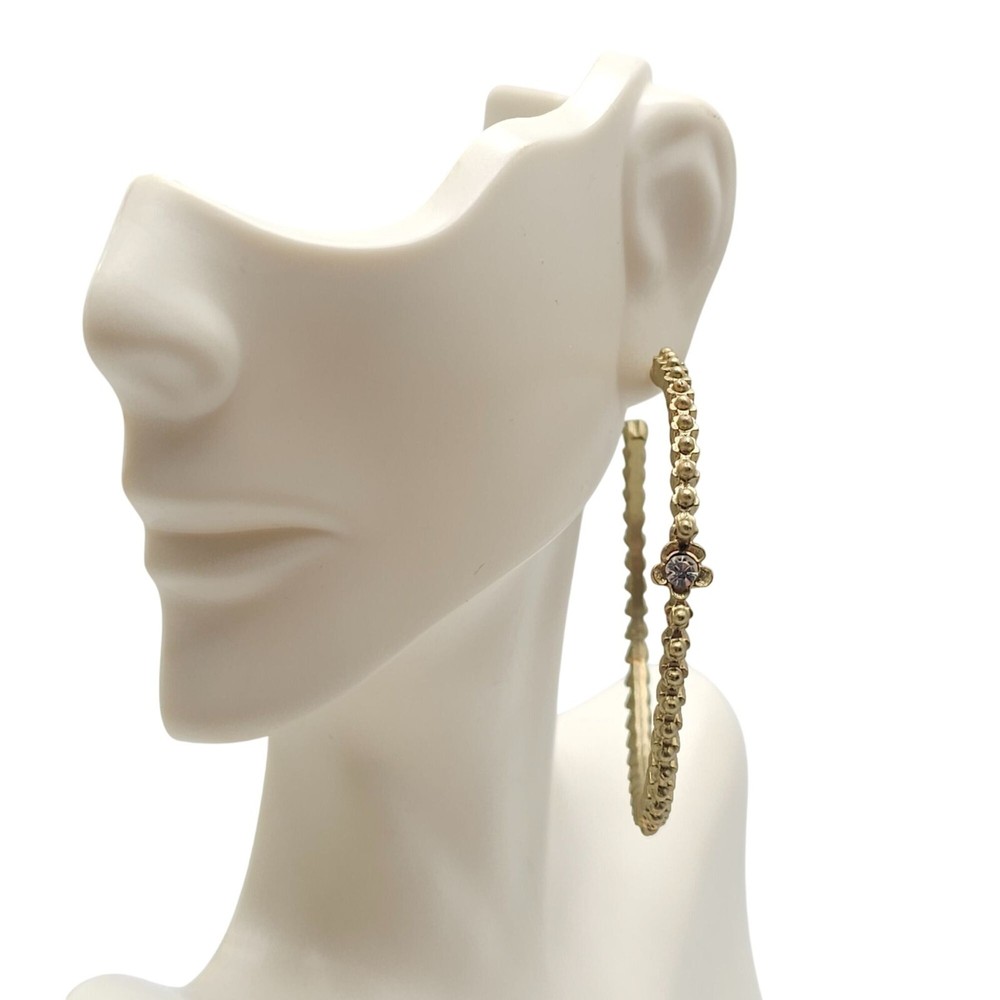 Gold Tone Textured Hoop Earrings With Rhinestone Flower Accents