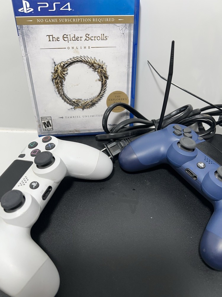 ps4 console and 2 controllers, game