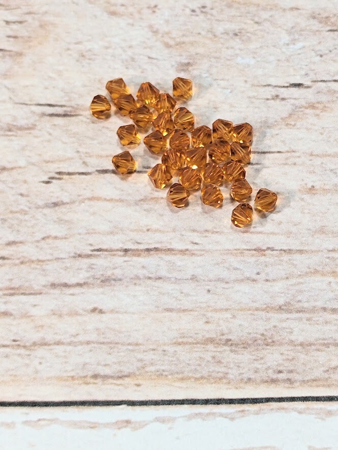 6 mm Orange Bicone Beads