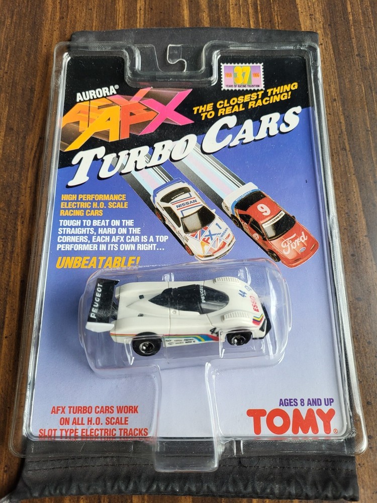 AFX TOMY TURBO CAR # 44 PEUGEOT HARD TO FIND IN PACKAGE MINT IN ON THE CARD !!!!