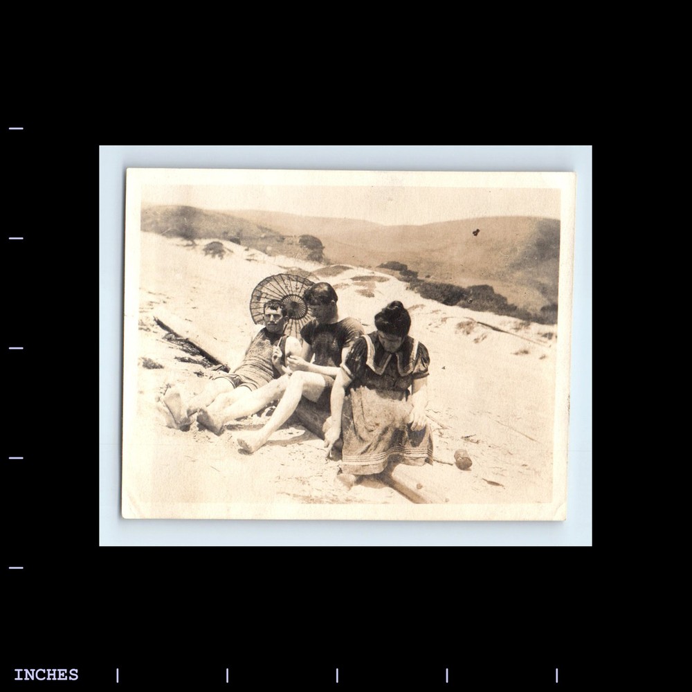 Vintage Beach Scene of Woman and Men Under Umbrella Retro Photo