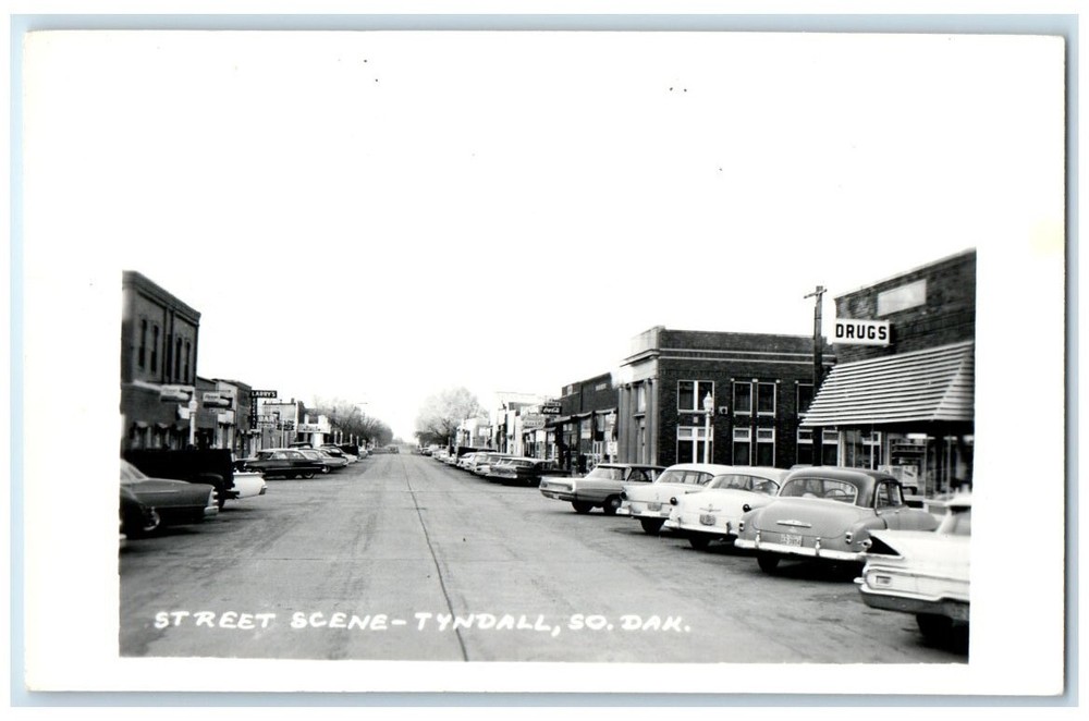 1967 Street Scene Drug Store Bakery Bar View Tyndall SD RPPC Photo Postcard