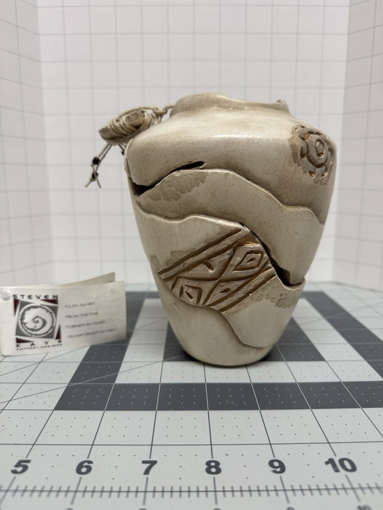 Steven Kaye gold and beige pottery vase 6 inches tall with asymmetrical slits