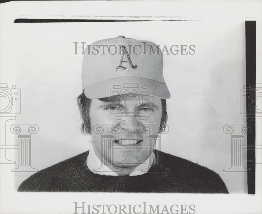 Press Photo A man in Oakland A's baseball cap - lra29391