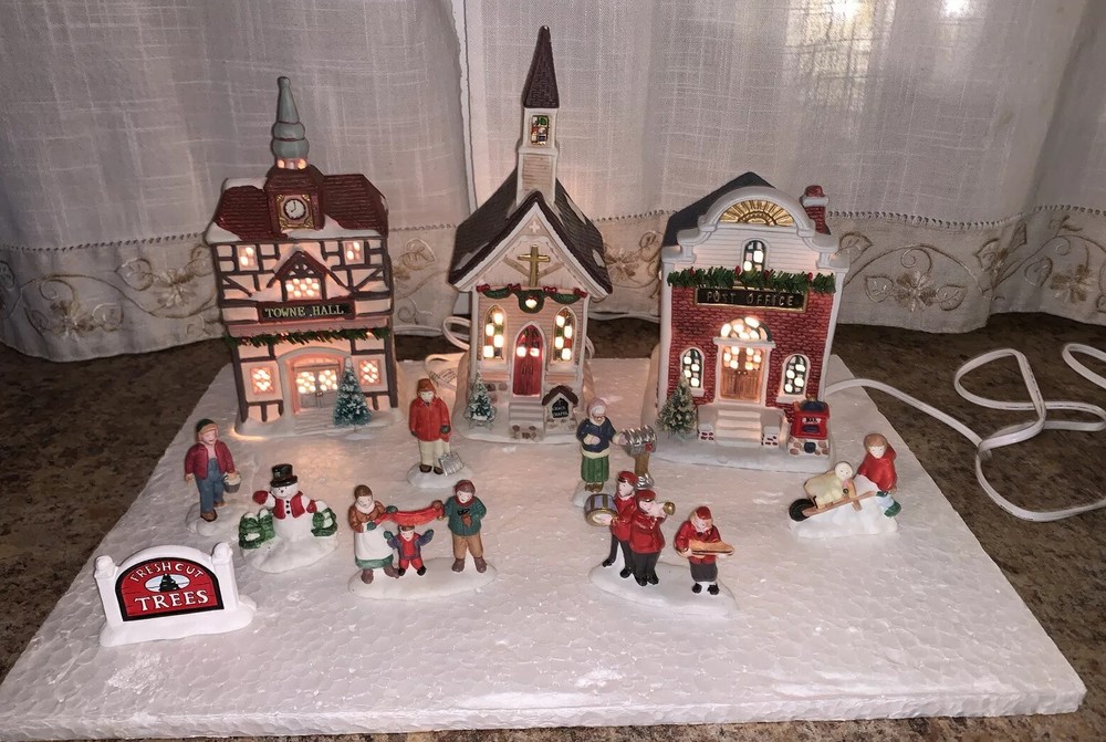 Discover Seasonal Specialties A Downtown Christmas 12-Piece Illuminated Christmas Village Set for a Festive Holiday Display-image