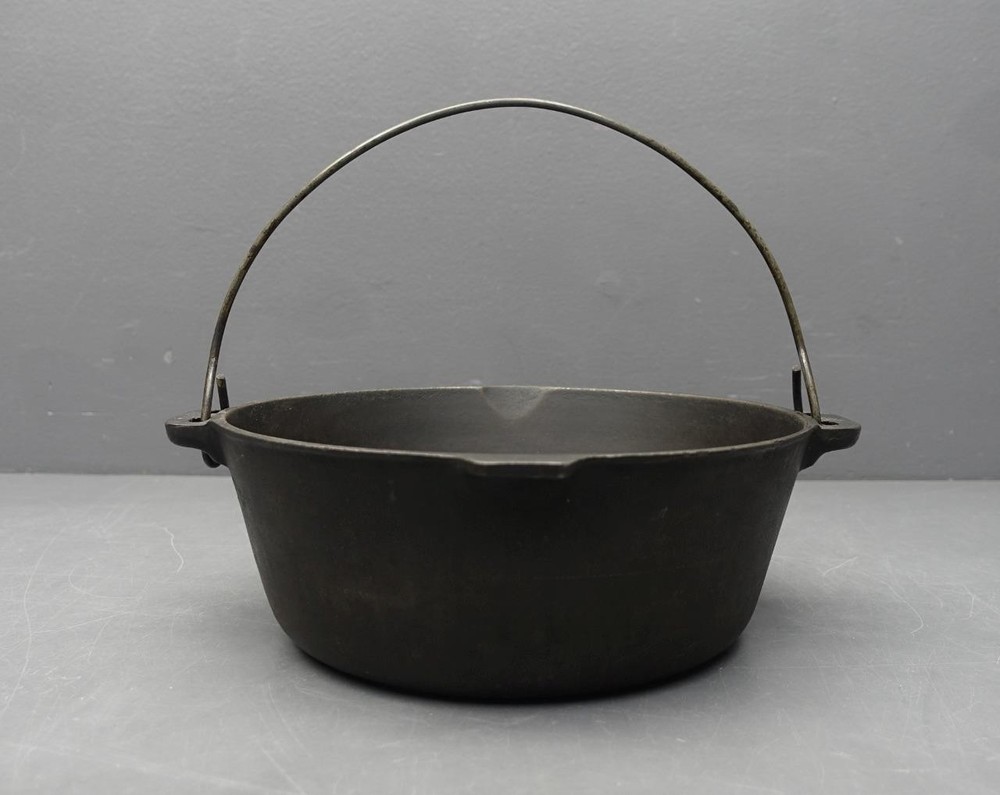Unmarked 10.75-inch Cast Iron Dutch Oven No Lid with Bail Handle  