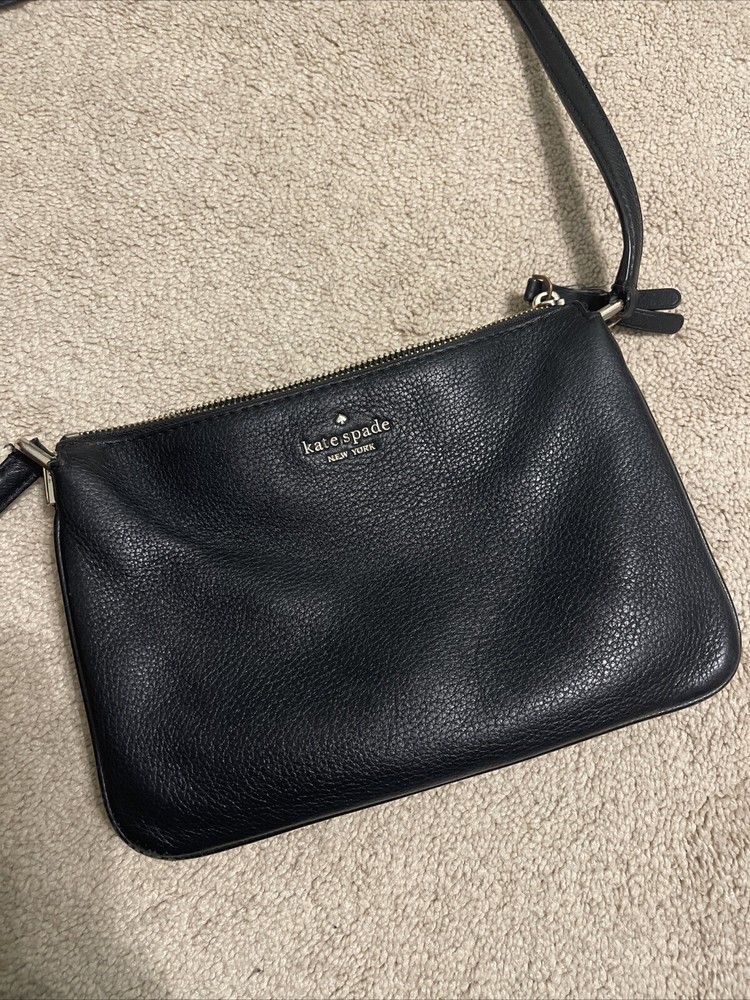 Kate Spade black leather crossbody bag with gold accents  