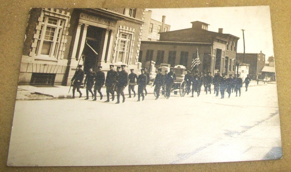 1920's RPPC Postcard~Soldiers Walking Down Street Funeral?~Inter State Bldg S1