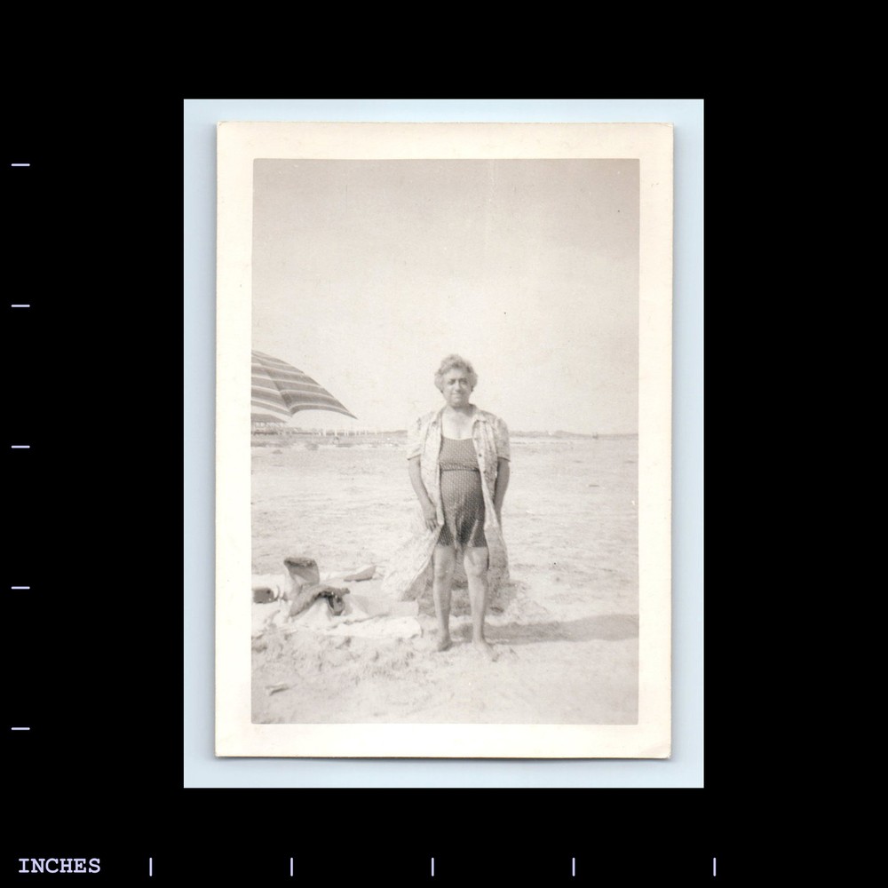 Vintage Beach Scene Woman Sitting Next to Umbrella Retro Photo