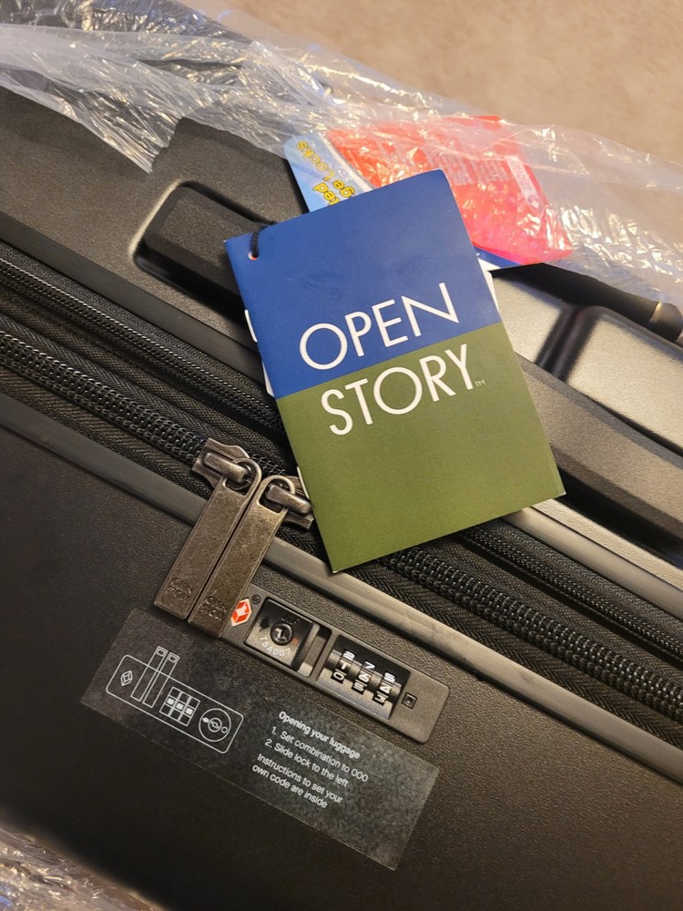 Open Story Signature Hardside Carry On Spinner Suitcase in Champagne Blue