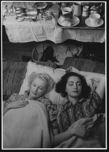 Two actreeses take a rest backstage at the Windmill Theatre in London Old Photo