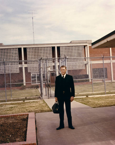 Steve McQueen stands outside prison gates in the 1972 Sam Peckinpa- Old Photo