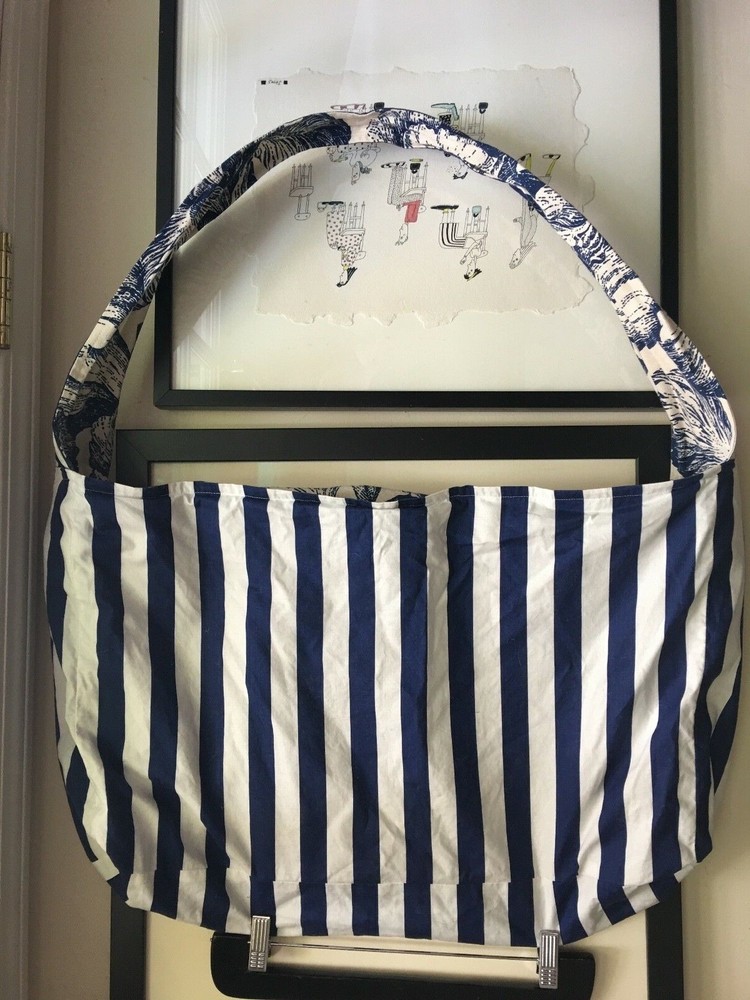 Reversible blue and white fabric tote bag with detachable label for shoulder or crossbody wear