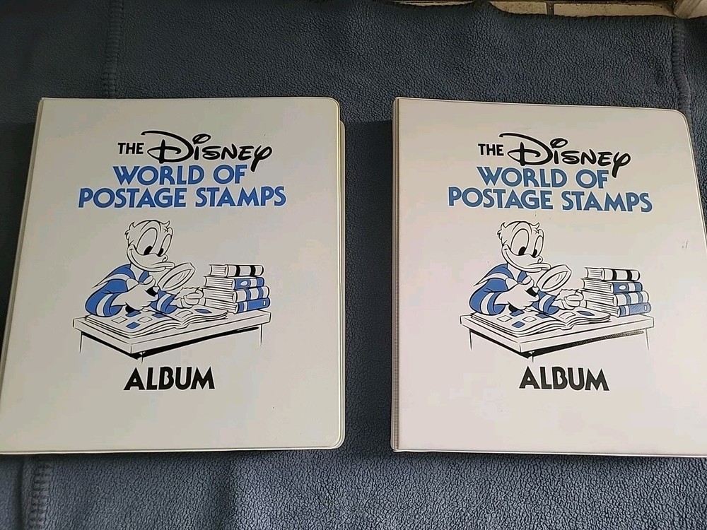 Two of the Disney World of Postage Stamps Albums With Stamps Collection