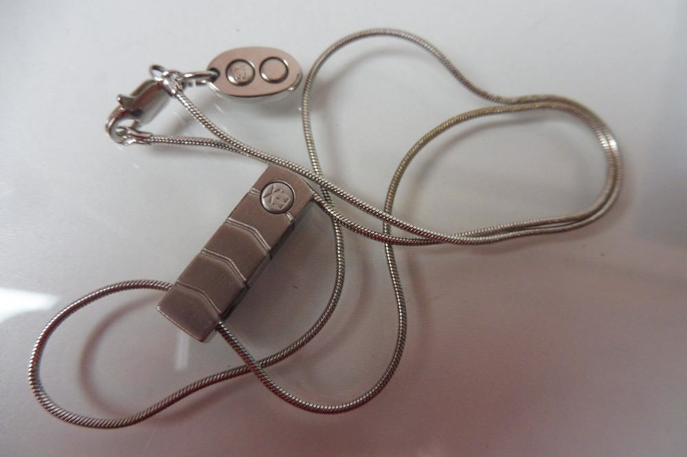Elegant EX Embossed Pendant Necklace with Stylish Chain Design