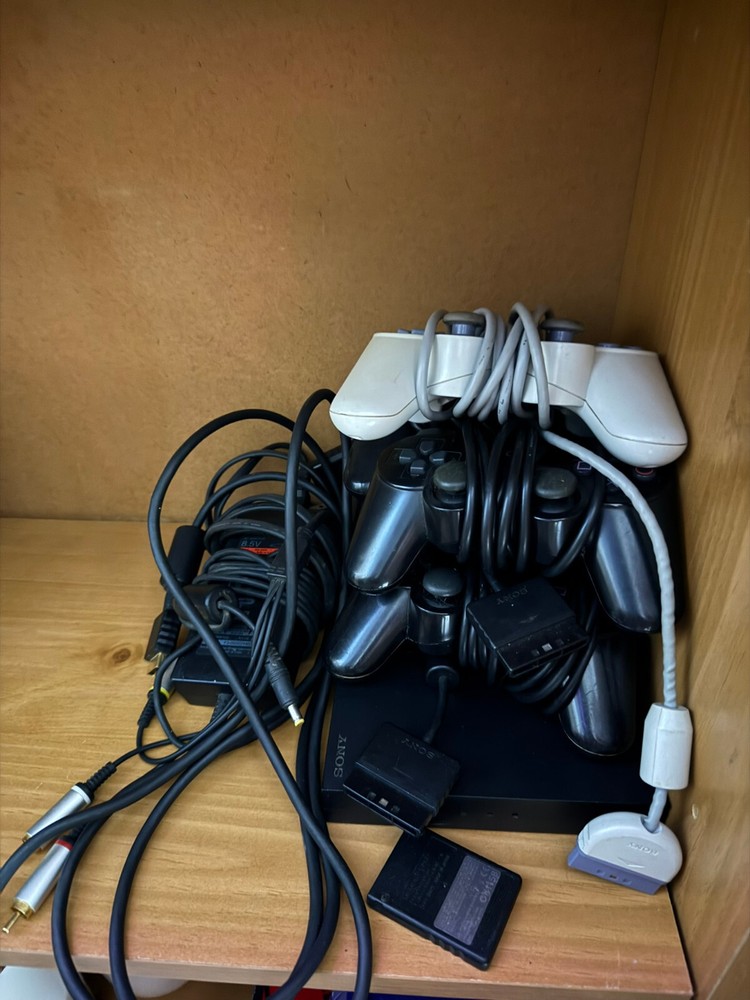Sony Plastation 2 Slim with Memory card and 5 Controllers.