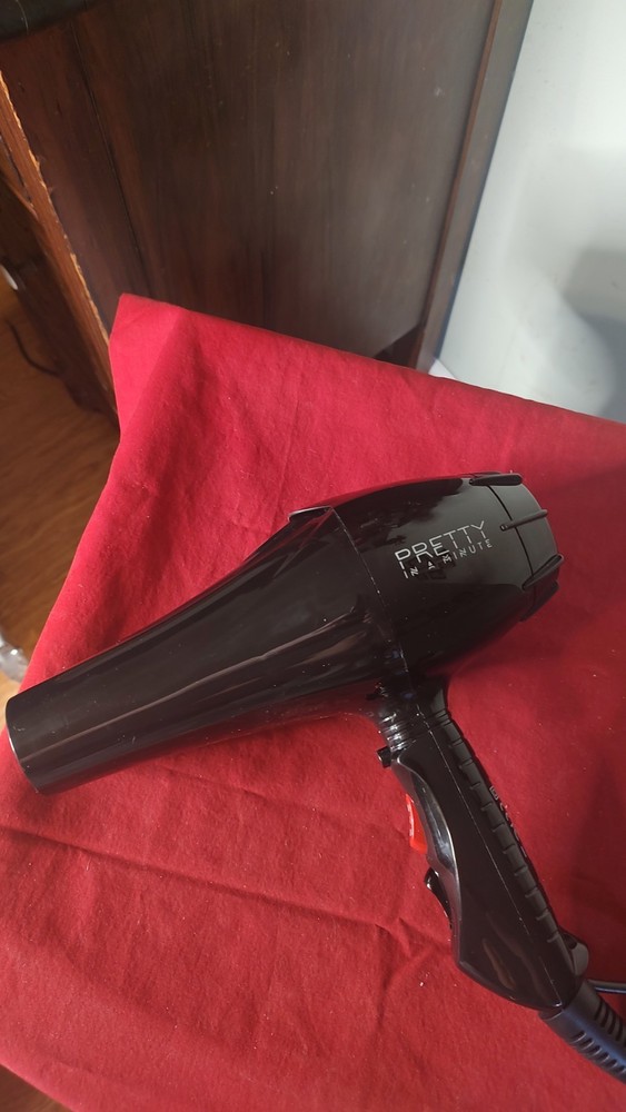 Pretty In A Minute Hair Dryer with A Concentrater and Free Combs. Gently Used.