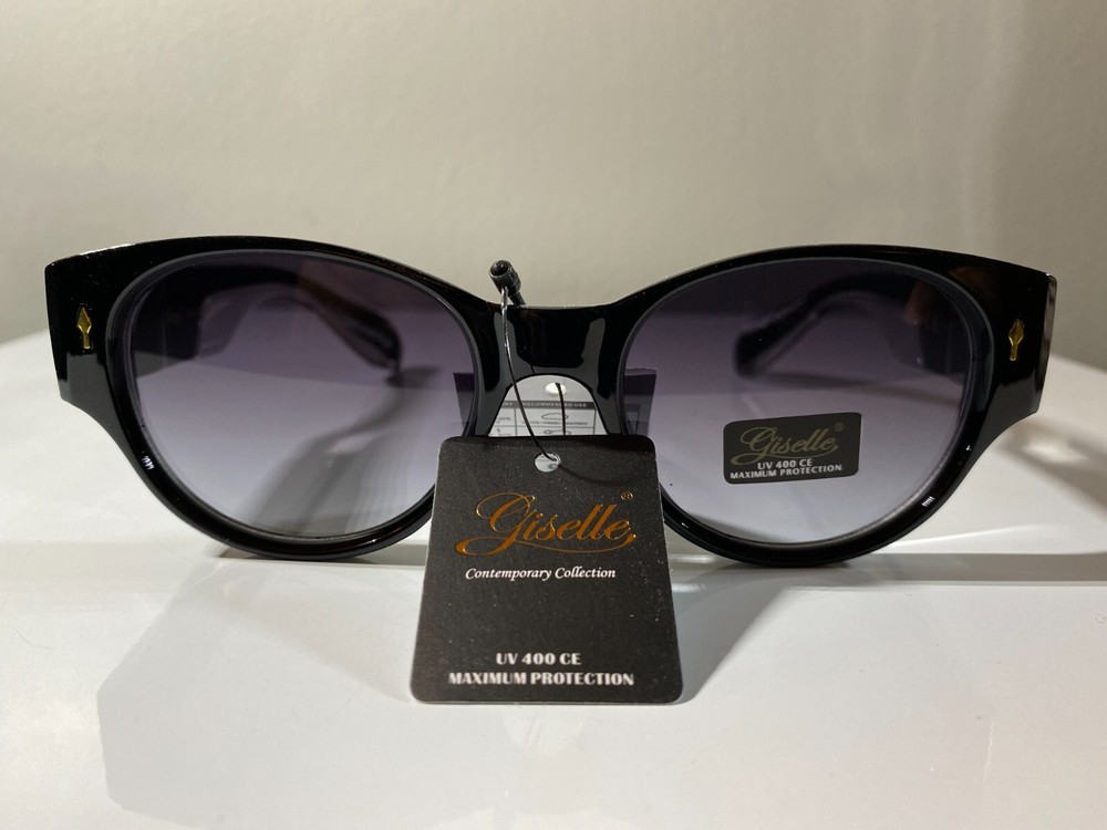 Women's cat eye style sunglasses with black frame and purple lenses
