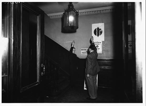 Two members of the British Union of Fascists salute one another at- Old Photo