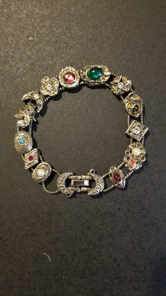 Victorian Revival style silver tone slide charm bracelet, 7