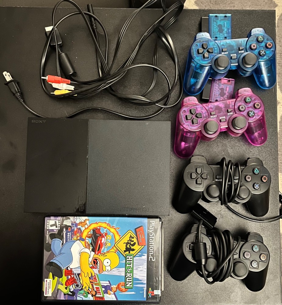 PlayStation 2 Slim Console Black-4 controllers 2 wired, 2 wireless w/ 1 game inc