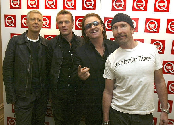 Members of U2 Adam Clayton Larry Mullen Bono and The Edge arrive - 2004 Photo 1-image