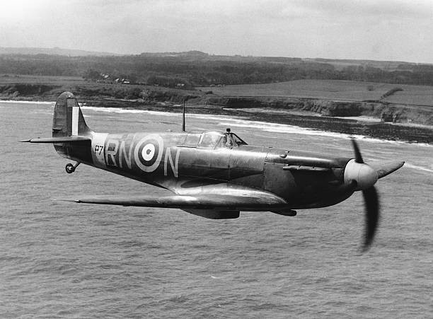 Spitfire in flight of the coast of Britain during World War II Old Photo
