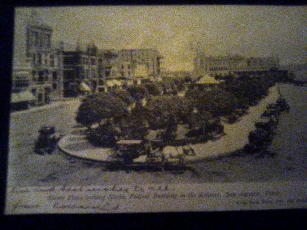 postcard Alamo Plaza looking North , Federal Building in the distance ,San Anton