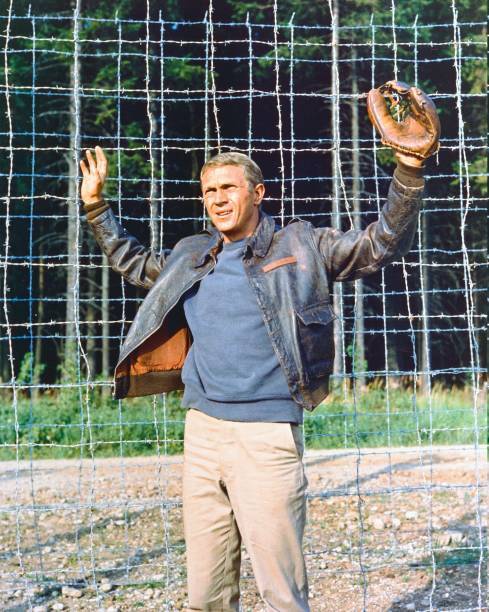 Steve McQueen wearing a leather jacket and a baseball glove with h- Old Photo