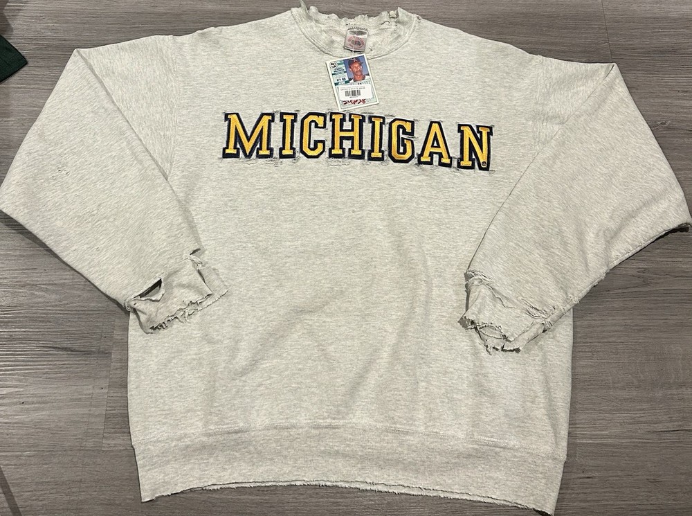 Vintage 90s Michigan Wolverines crewneck sweatshirt with a distressed look