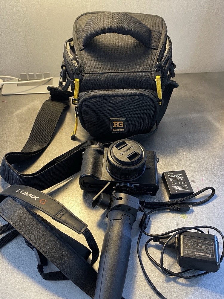 Panasonic Lumix G100D Mirrorless Camera w 12-32mm lens, tripod+batteries+bag